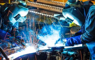 Welders working in a shipyard