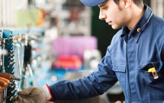 Industrial Worker Servicing a Panel