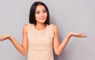 Woman shrugging her shoulders