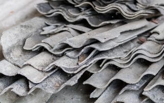 Asbestos roof shingles